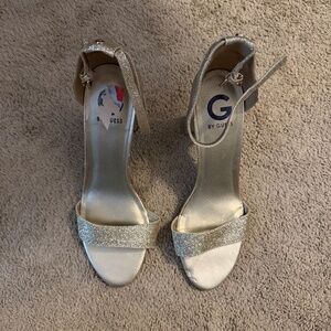 Sparkly, gold, 4-inch Guess open toe, ankle strap, heels